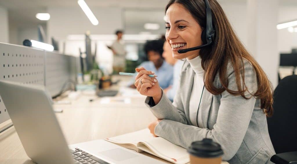 A smiling woman working at an answering service