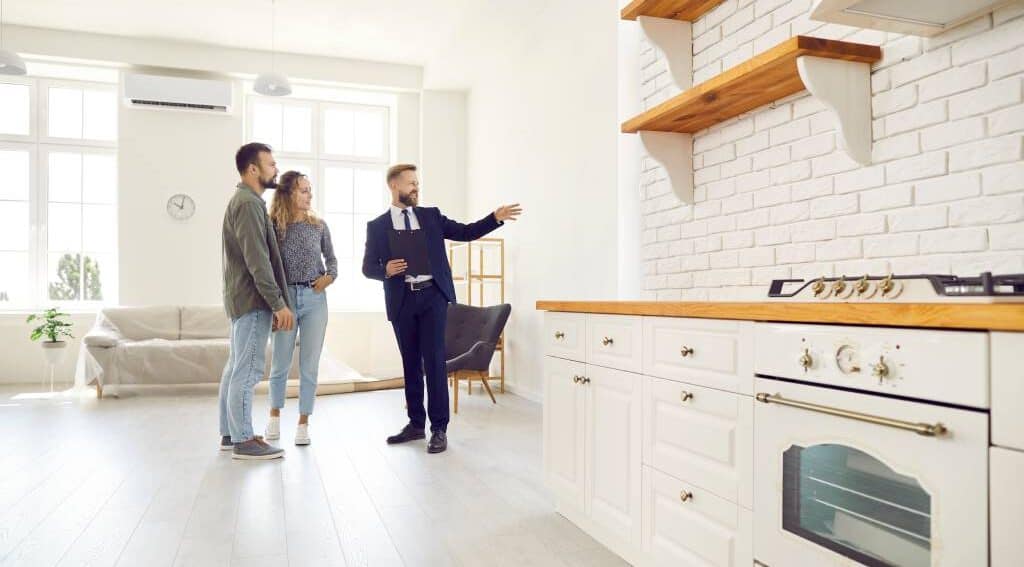Real estate agent showing a house