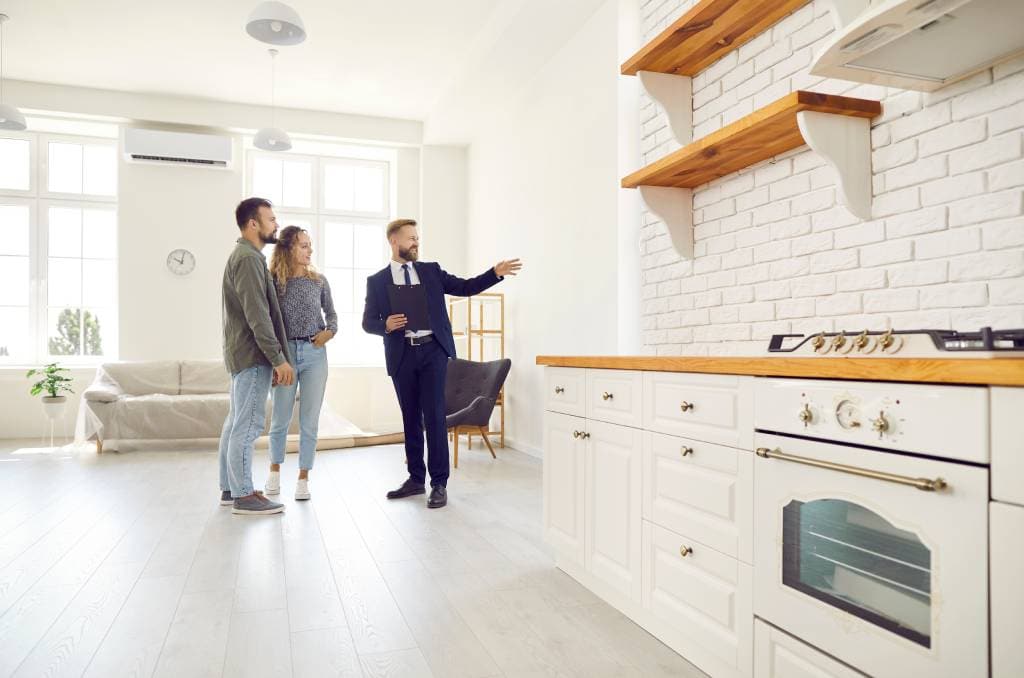 Real estate agent showing a house