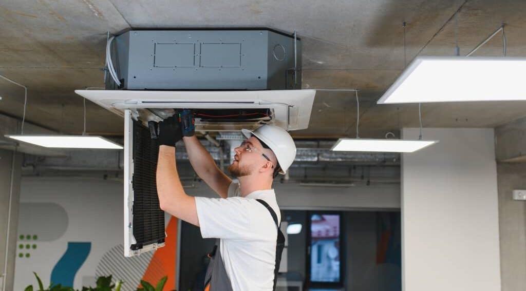Professional HVAC worker with a hardhat